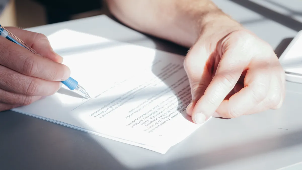 Best SaaS Tools for Document Signing — A Person Signing a Document