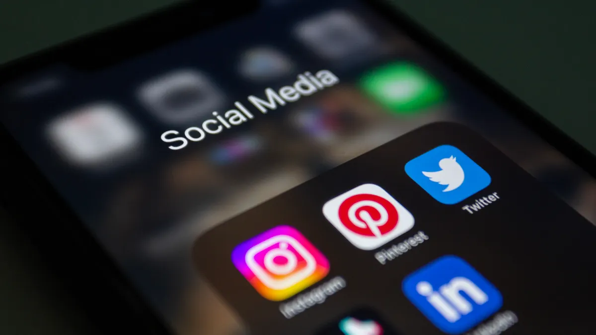 Best SaaS Tools for Social Media Management — Close-up of a Smartphone Screen Displaying Social Media App Folder