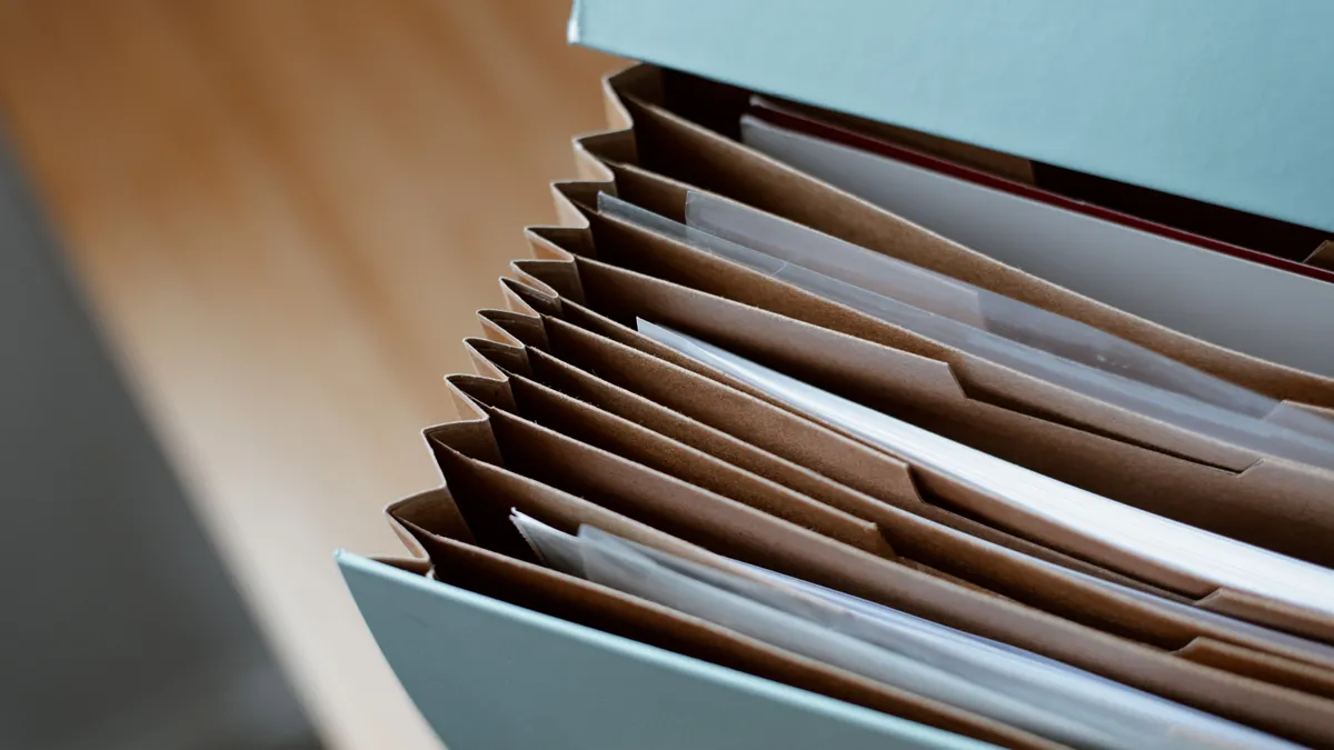 Open file box packed with paper folders