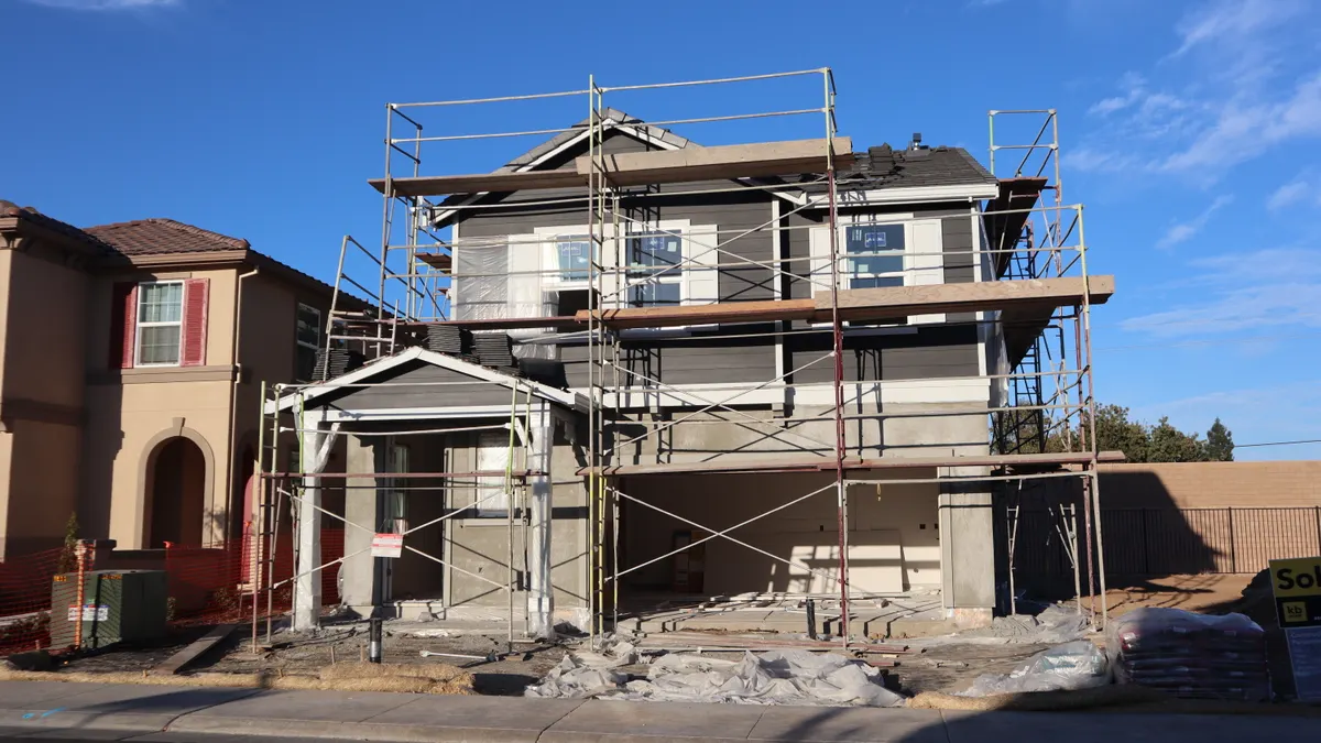 SaaS Comparison Framework: How to Compare Two Tools Side by Side — Two-Story House Construction with Scaffolding